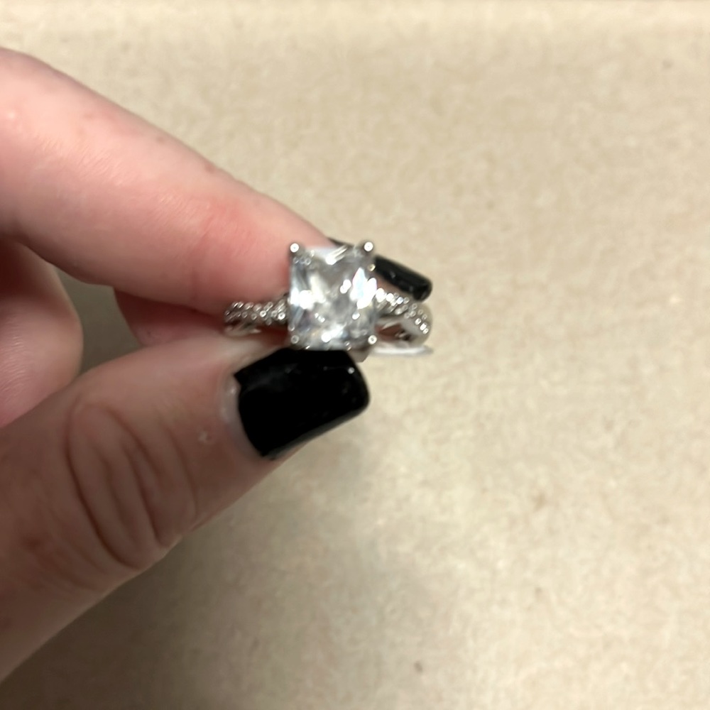 18K white gold emerald cut solitaire ring
